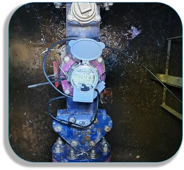 Technician mounting MHA sensor on a large meter